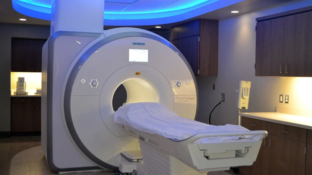 MRI machine suitable for clinics showing scanner and control room setup
